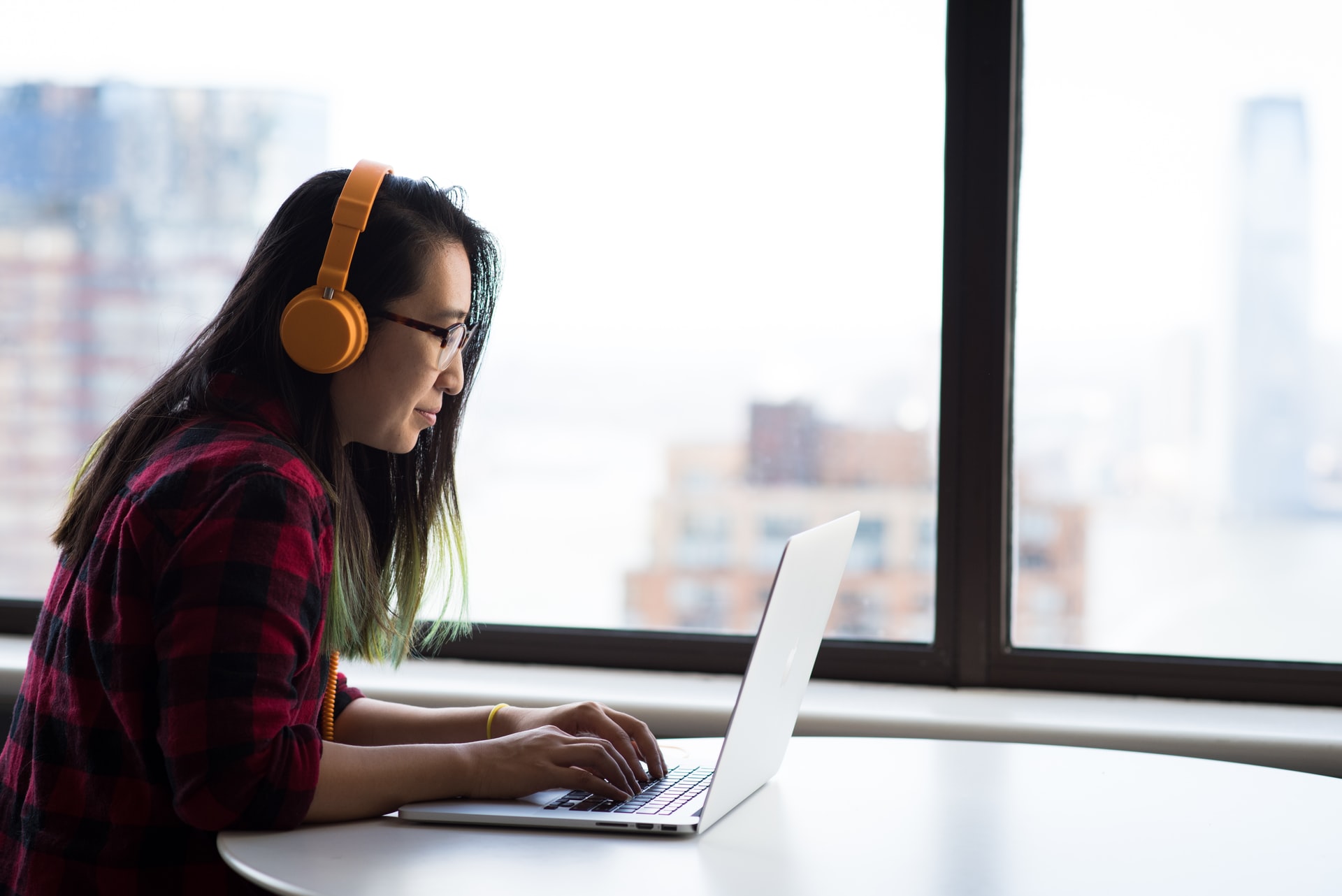 Female postgraduate studying online